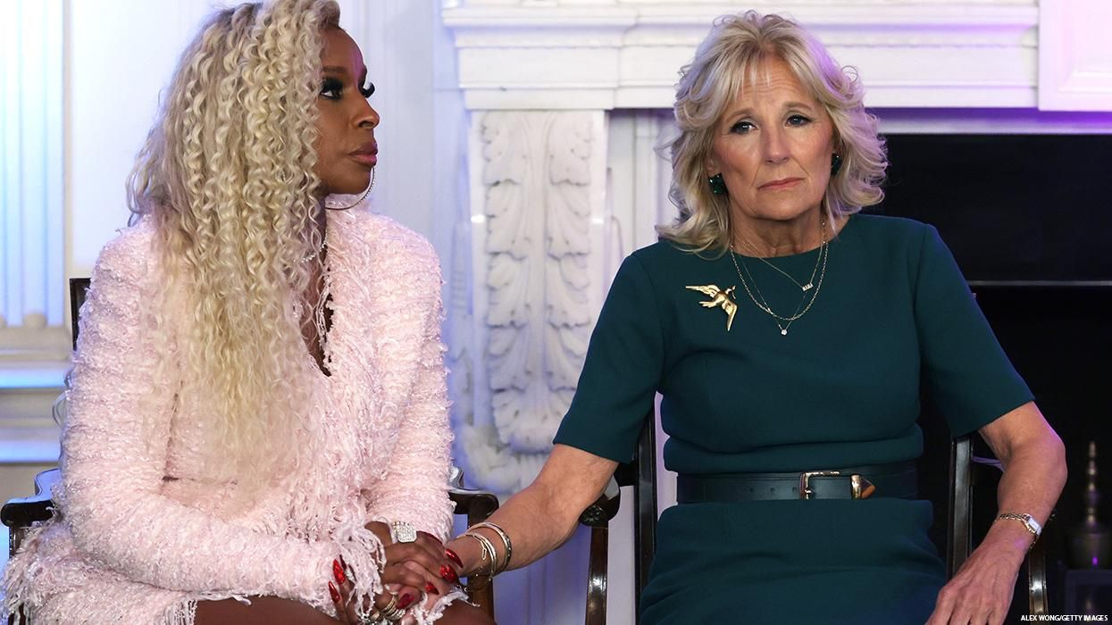 Mary J. Blige and Jill Biden hold hands
