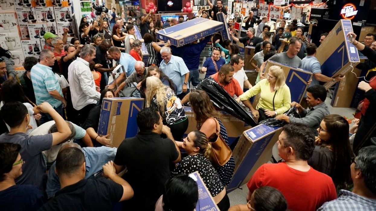 People participate in a "Black Friday" event anticipated in São Paulo, Brazil, on November 22, 2018. 