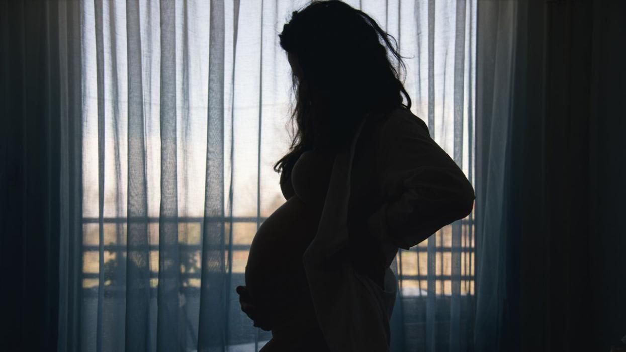 The silhouette of a pregnant woman
