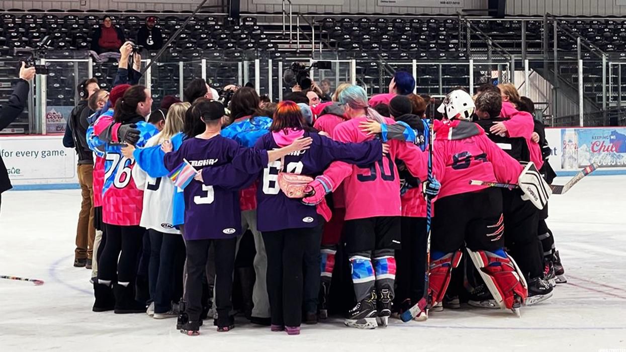 Transgender hockey players embrace in a group hug 